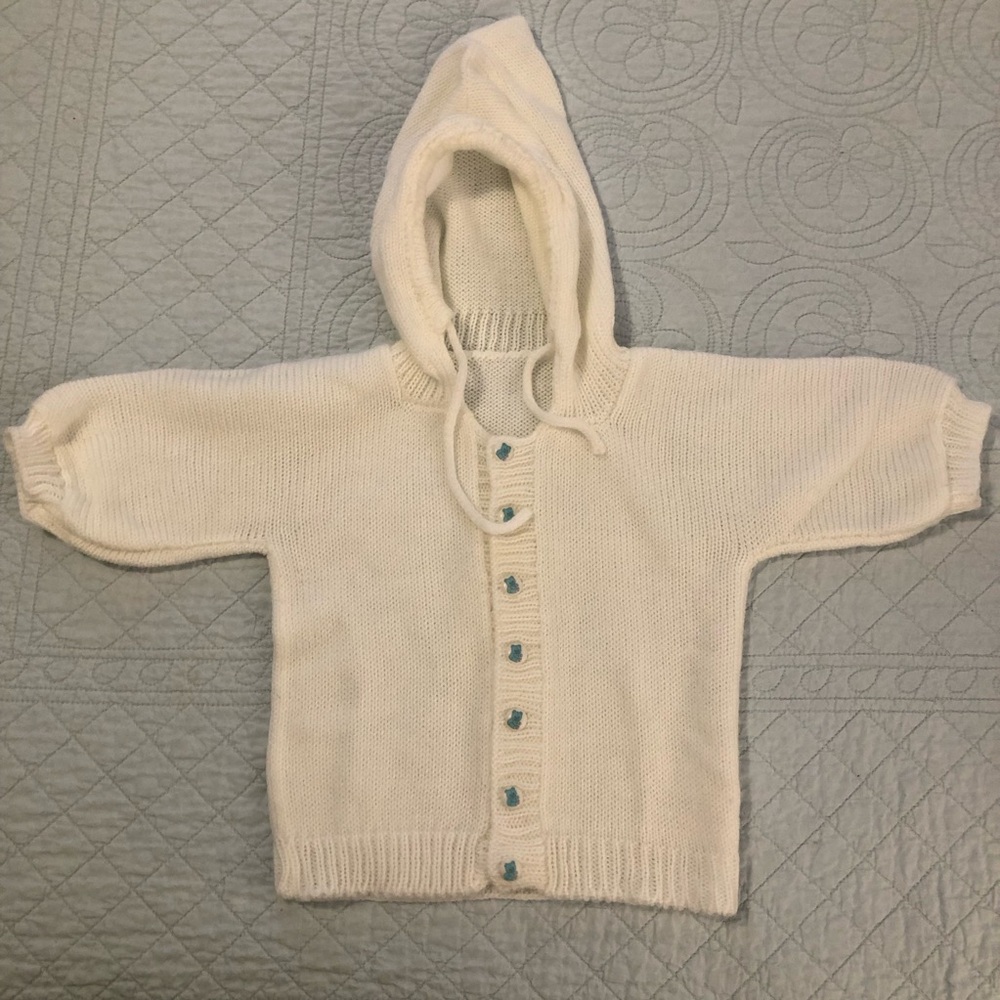 Hand knit hooded baby sweater and hats bundle.